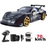 Contenu de la boîte de la GT-S RC drift : radiocommande, pneus, câble et 2 batteries